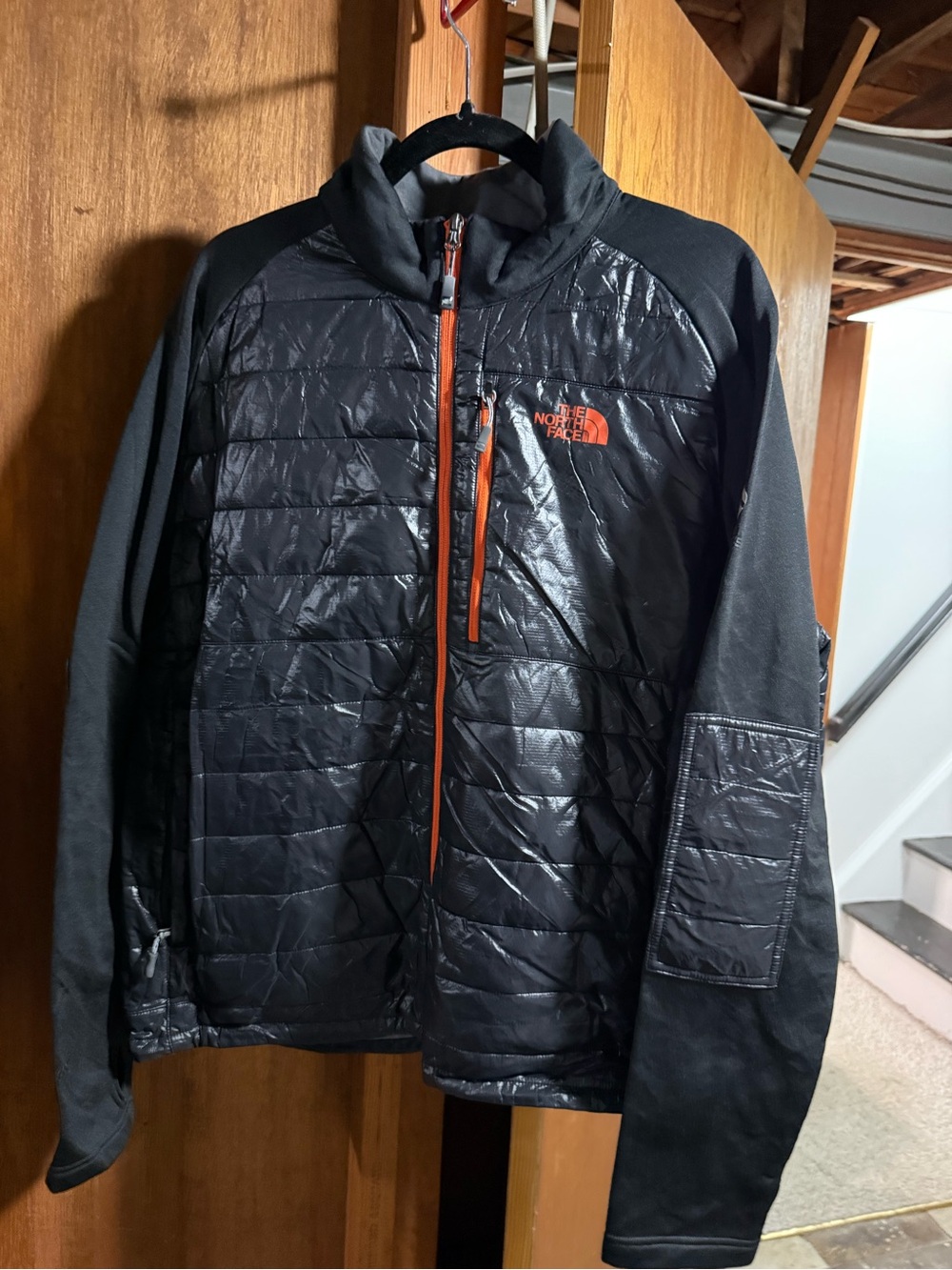 The North Face Men’s Black Puffer Jacket with Orange Zipper Accents